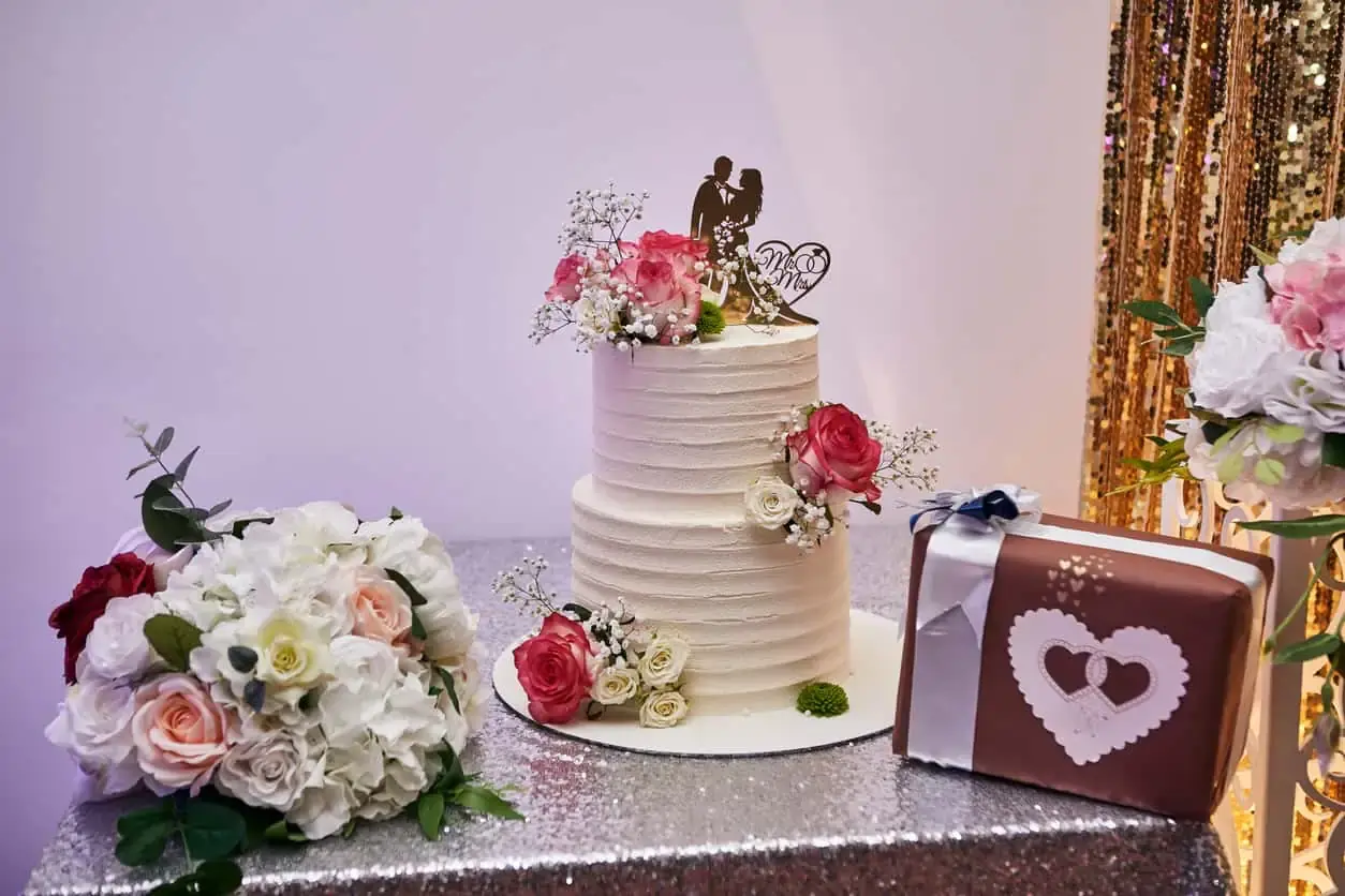 two tier cake with a subtle ruffled texture finish
