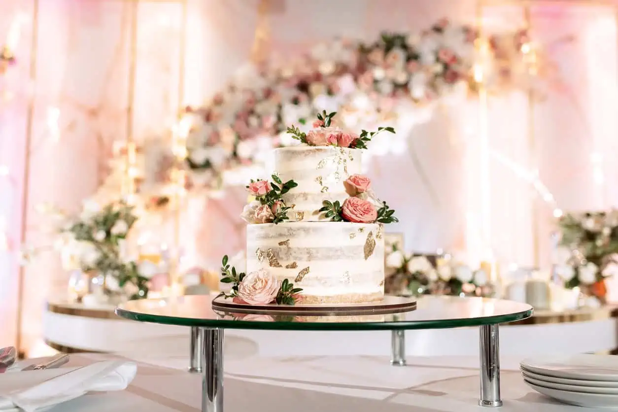 two tier wedding cake with a pink rose garden look