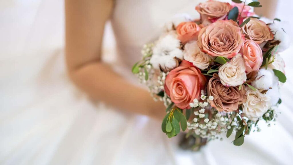bride holding flowers at her wedding